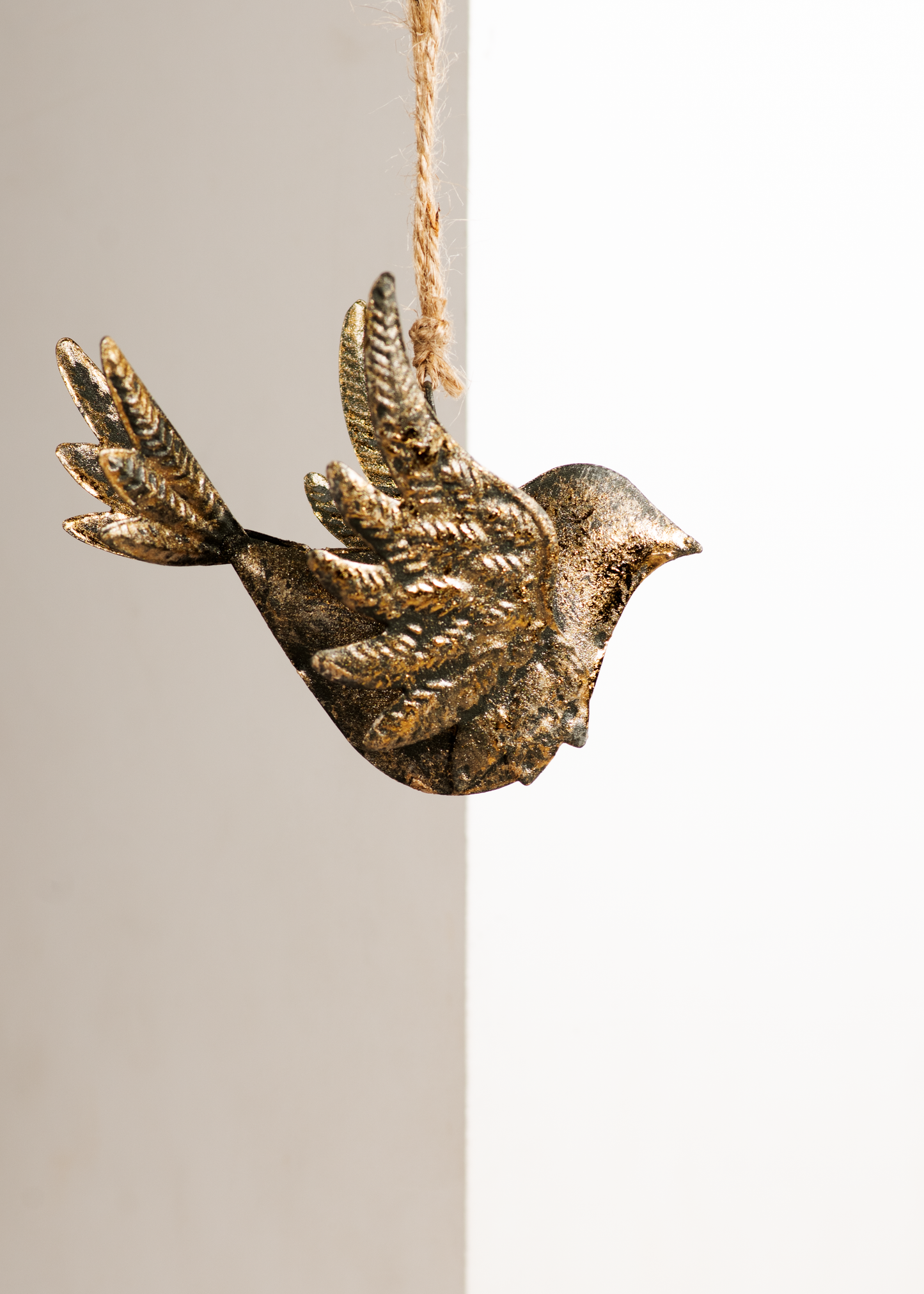 Antique gold metal dove ornament with textured wings