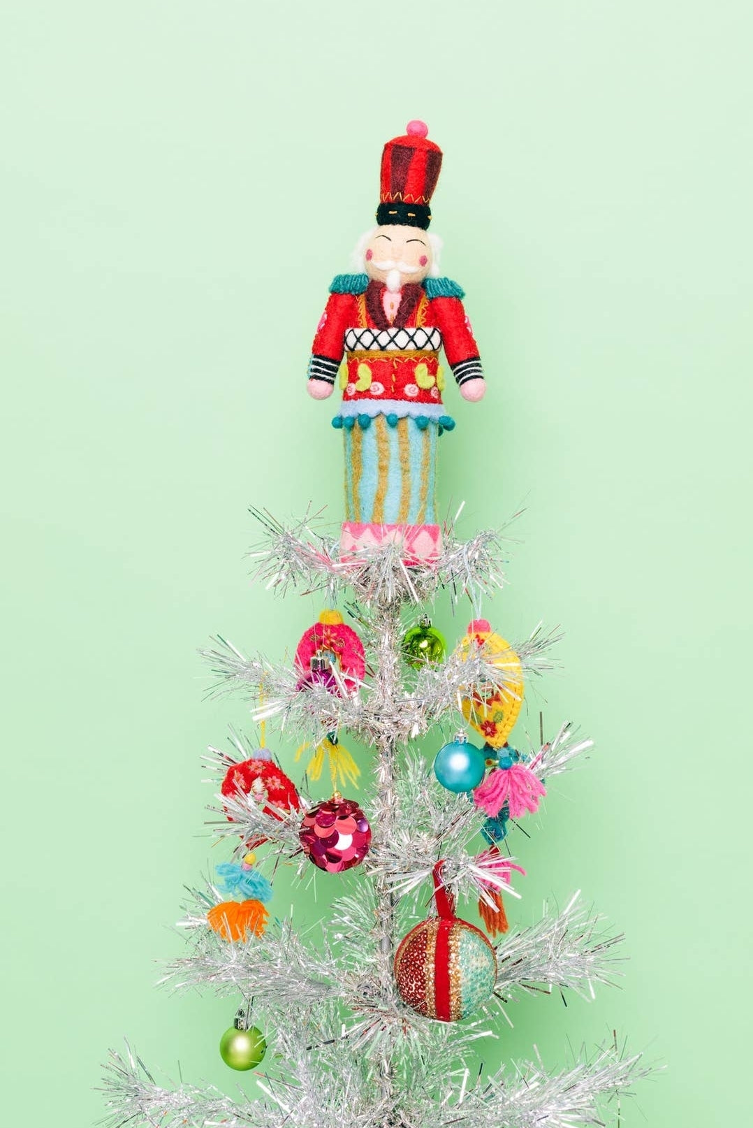 Festive felt nutcracker figure with embroidered details