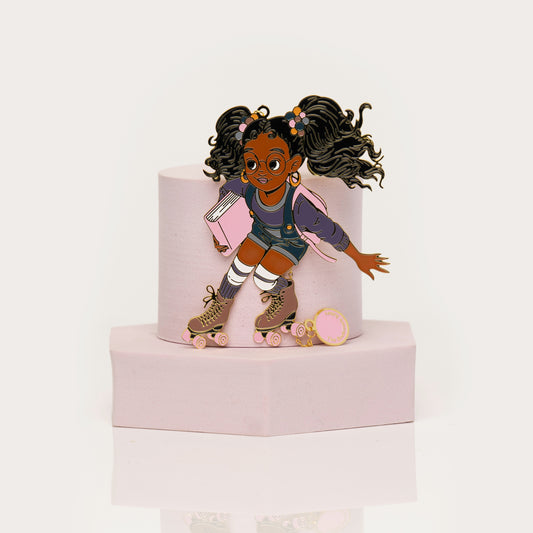 Enamel bookmark of Black girl on rollerskates holding a book
