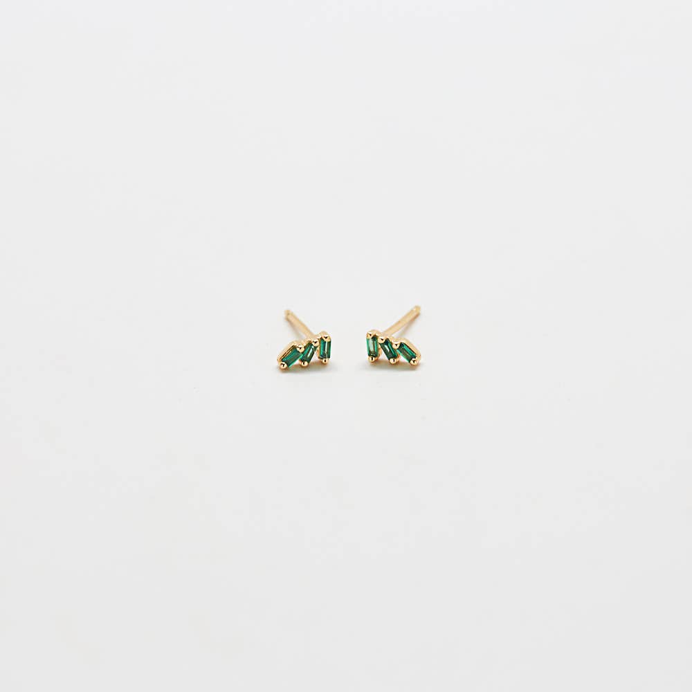 Green triple baguette CZ stud earrings in gold, worn on ear with a minimal, everyday jewelry aesthetic.